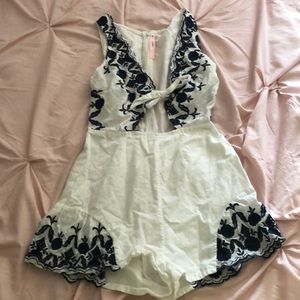 White and navy blue floral stitched romper